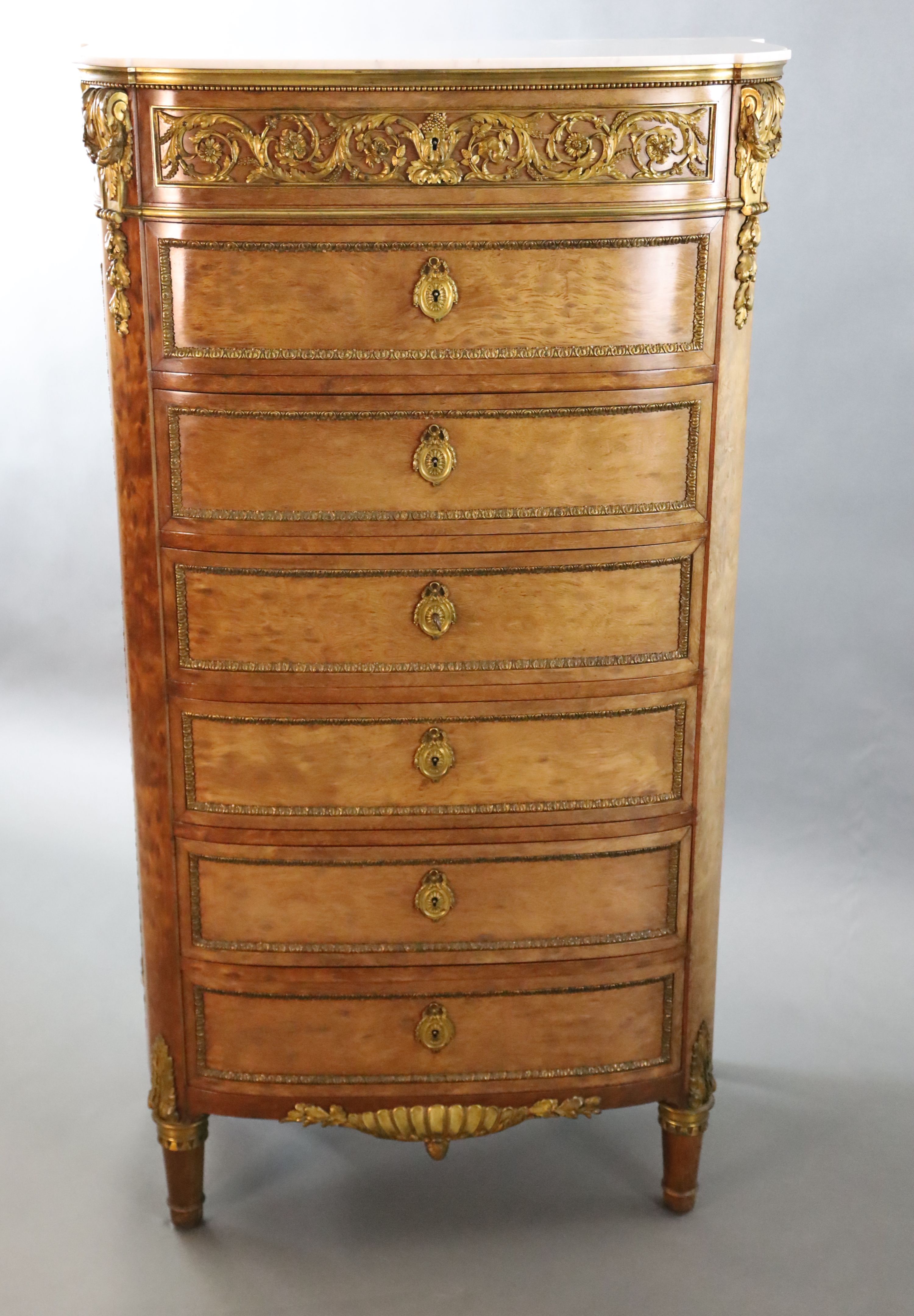 A Louis XVI style ormolu mounted mahogany semanier, W.2ft 7.5in. D.1ft 6.5in. H.4ft 7.5in.
